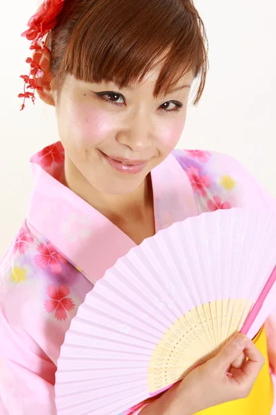 Young woman with paper Fan　 — 图库照片